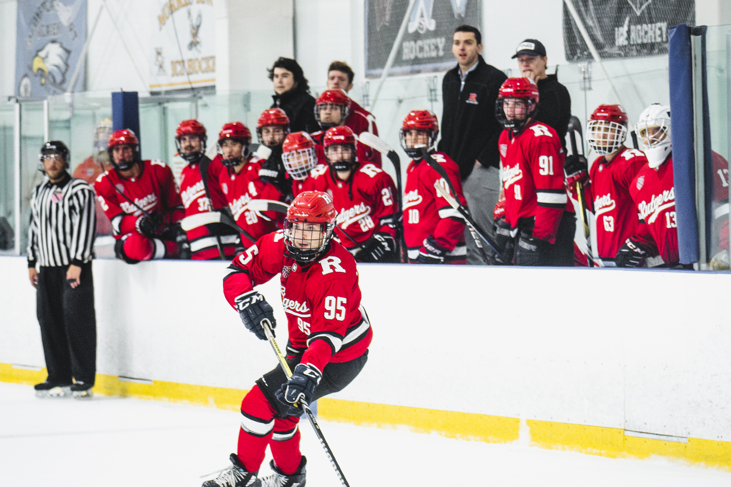 Rutgers players looking on from their team bench